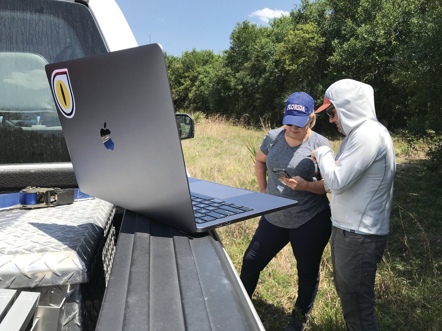 UF/IFAS lead scientist, Melissa Miller, receives training on the web application and operation of the traps from Ben Stookey of Wild Vision Systems. [Photo courtesy UF/IFAS]